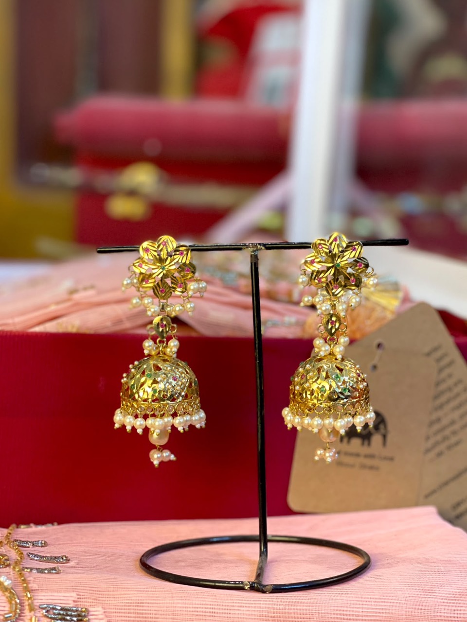 Floral Pearl Jhumka Earrings in a gold-tone finish with pearl-look bead details